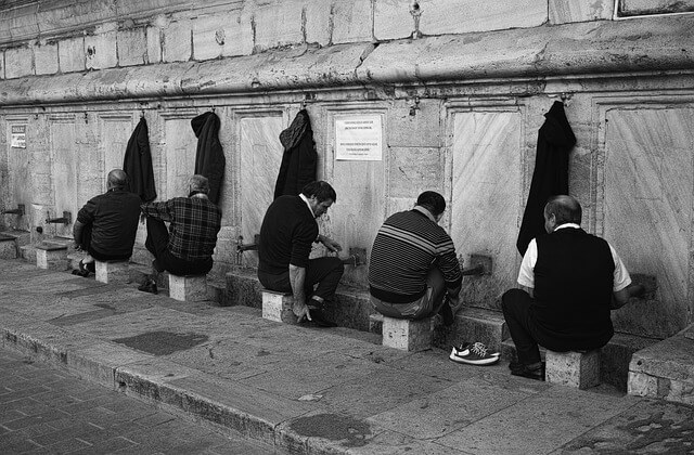 Some Muslims performing wudu