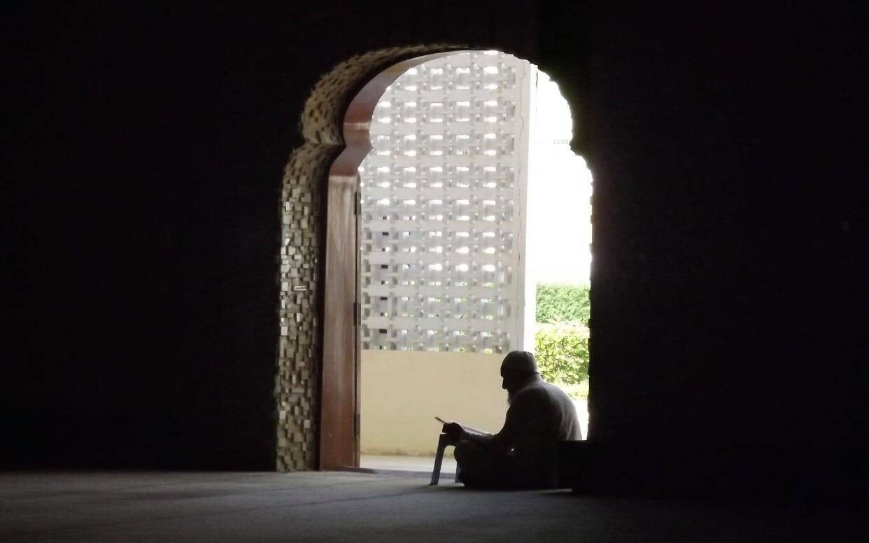 A man reciting Quran in the mosque