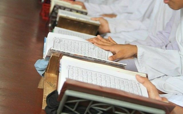Muslim kids learning Quran in a Masjid