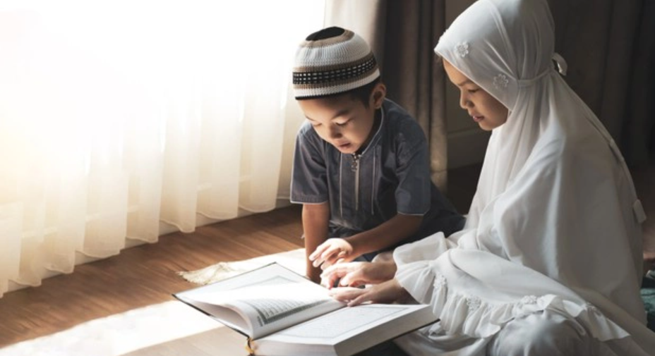 A boy and a girl reciting the Quran