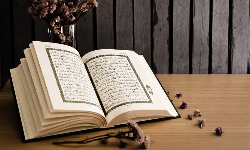 A copy of the Quran with a flower
